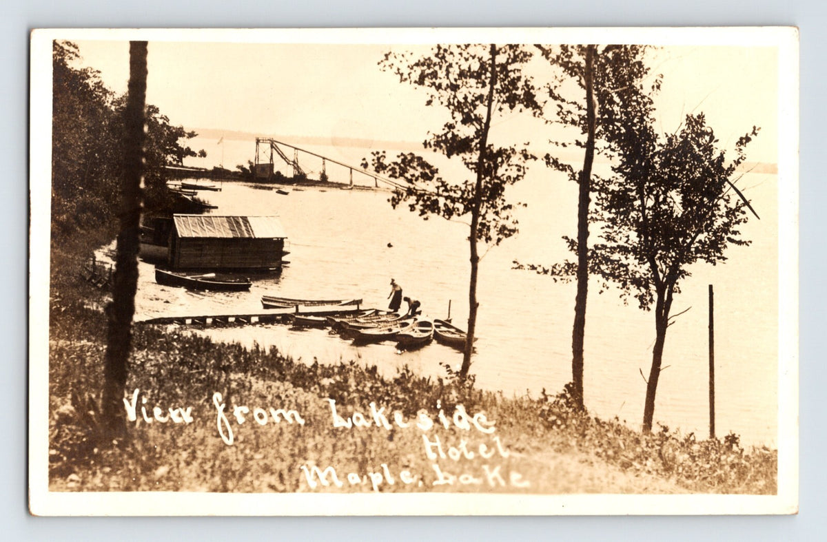 Real photo postcard view from Lakeside Hotel Maple Lake Minnesota with dock boats and lakeshore 1910s