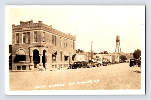 Philip South Dakota Main Street downtown view with water tower 1930s real photo postcard