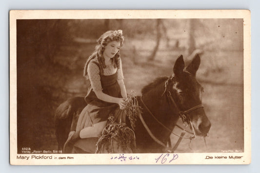 Mary Pickford seated on mule in Die kleine Mutter Ross Verlag 1930s RPPC postcard