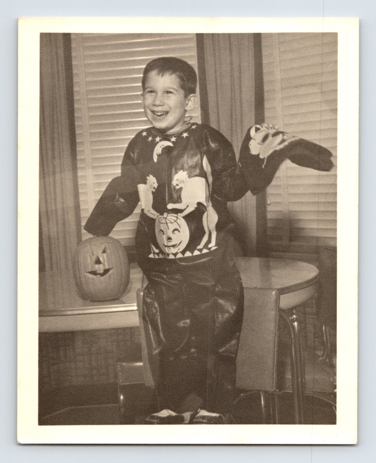 Boy Halloween costume pumpkin jack o lantern mask indoors 1954 snapshot photo 5 x 4