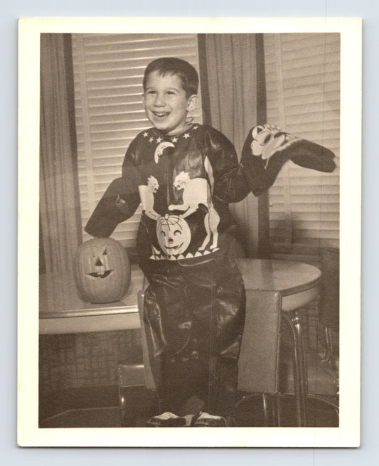 Boy Halloween costume pumpkin jack o lantern mask indoors 1954 snapshot photo 5 x 4