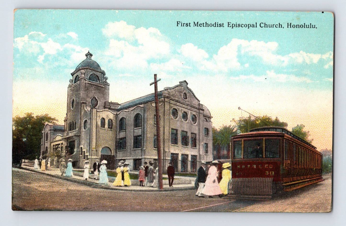 Hand-colored postcard showing First Methodist Episcopal Church in Honolulu, Hawaii, with domed tower, pedestrians in period dress, and streetcar in foreground; divided back format.
