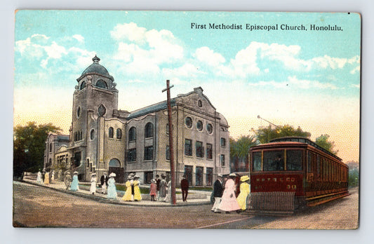 Hand-colored postcard showing First Methodist Episcopal Church in Honolulu, Hawaii, with domed tower, pedestrians in period dress, and streetcar in foreground; divided back format.