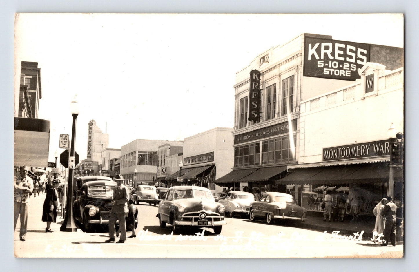 Downtown Eureka California Fourth Street with Kress 5-10-25 Store and Montgomery Ward storefronts, 1940s real photo postcard street scene with vintage cars
