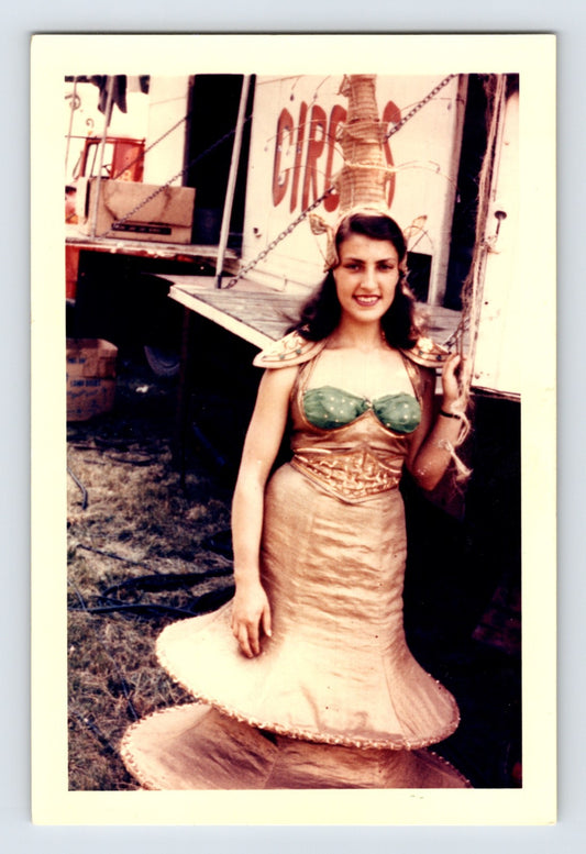 Mills Bros Circus 1960s woman performer in costume standing beside circus truck backstage photograph