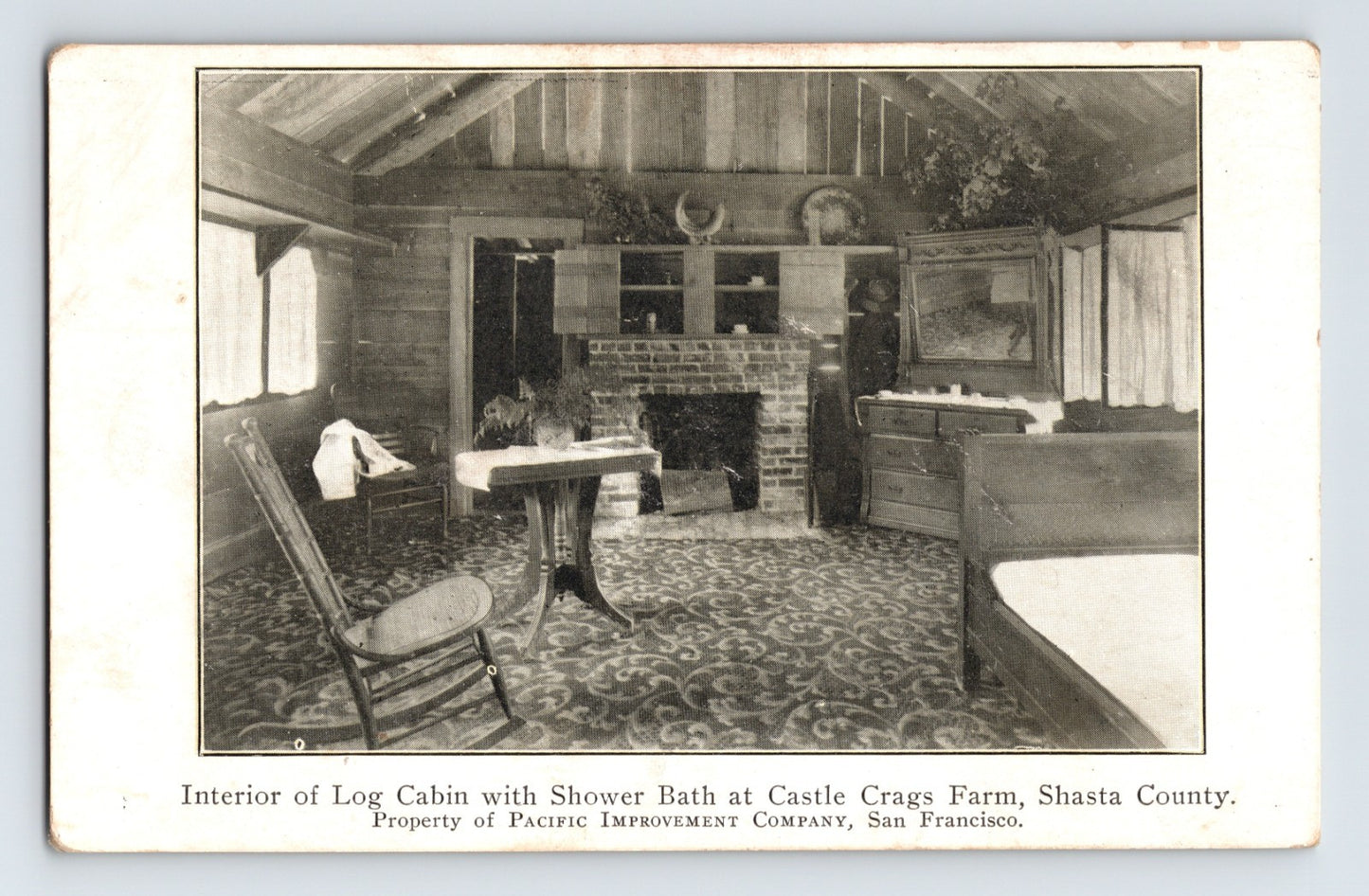 Interior of log cabin with shower bath Castle Crags Farm Shasta County California 1910s postcard