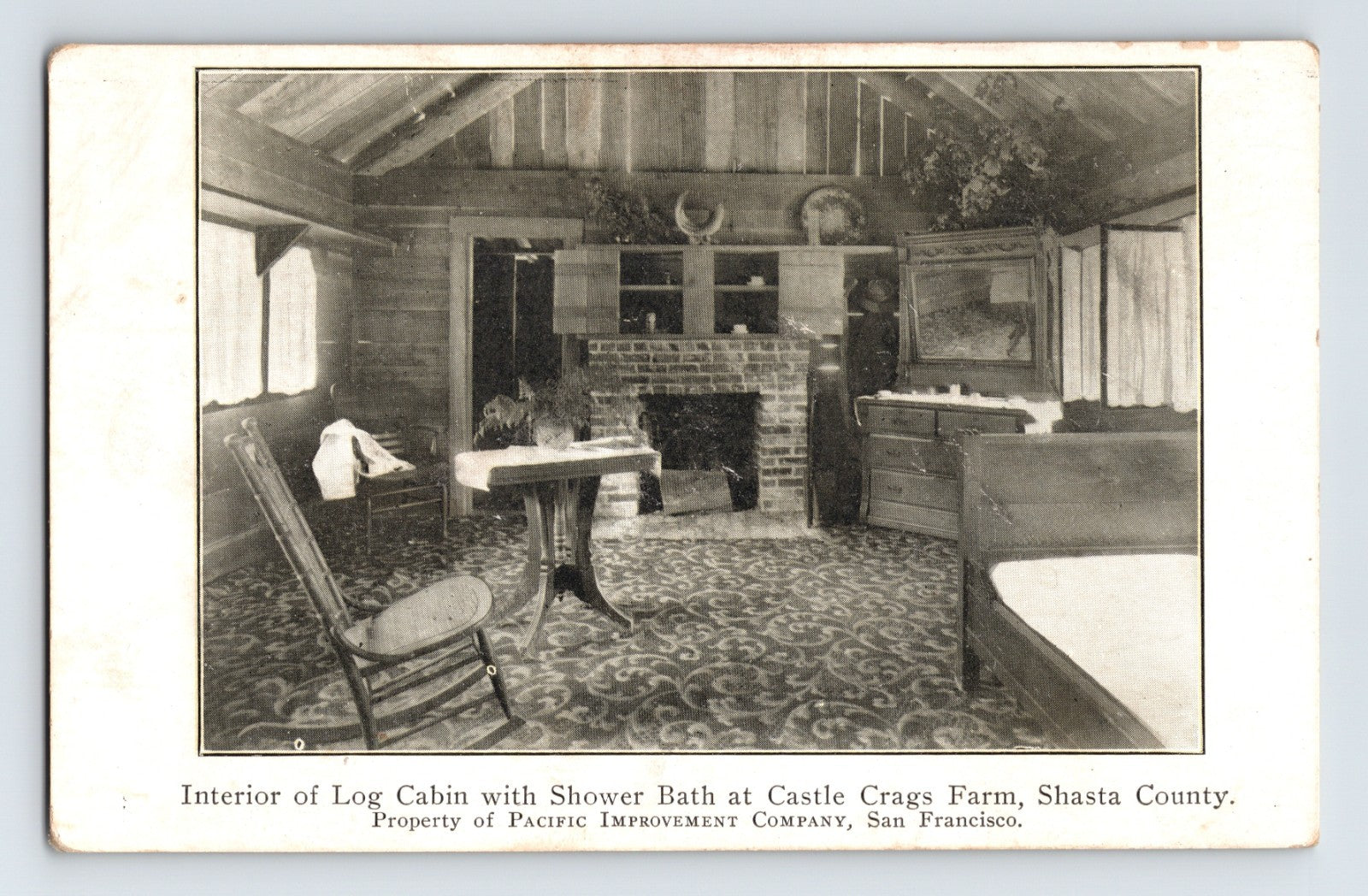 Interior of log cabin with shower bath Castle Crags Farm Shasta County California 1910s postcard