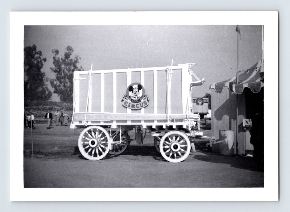 Disneyland Mickey Mouse Club Circus wagon with Mickey Mouse Club Circus sign in foreground and O J Keller wagon visible in background circus grounds 1956 photograph