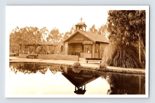 Buena Park California chapel and reflecting pond real photo postcard with mission-style architecture and landscaped grounds.