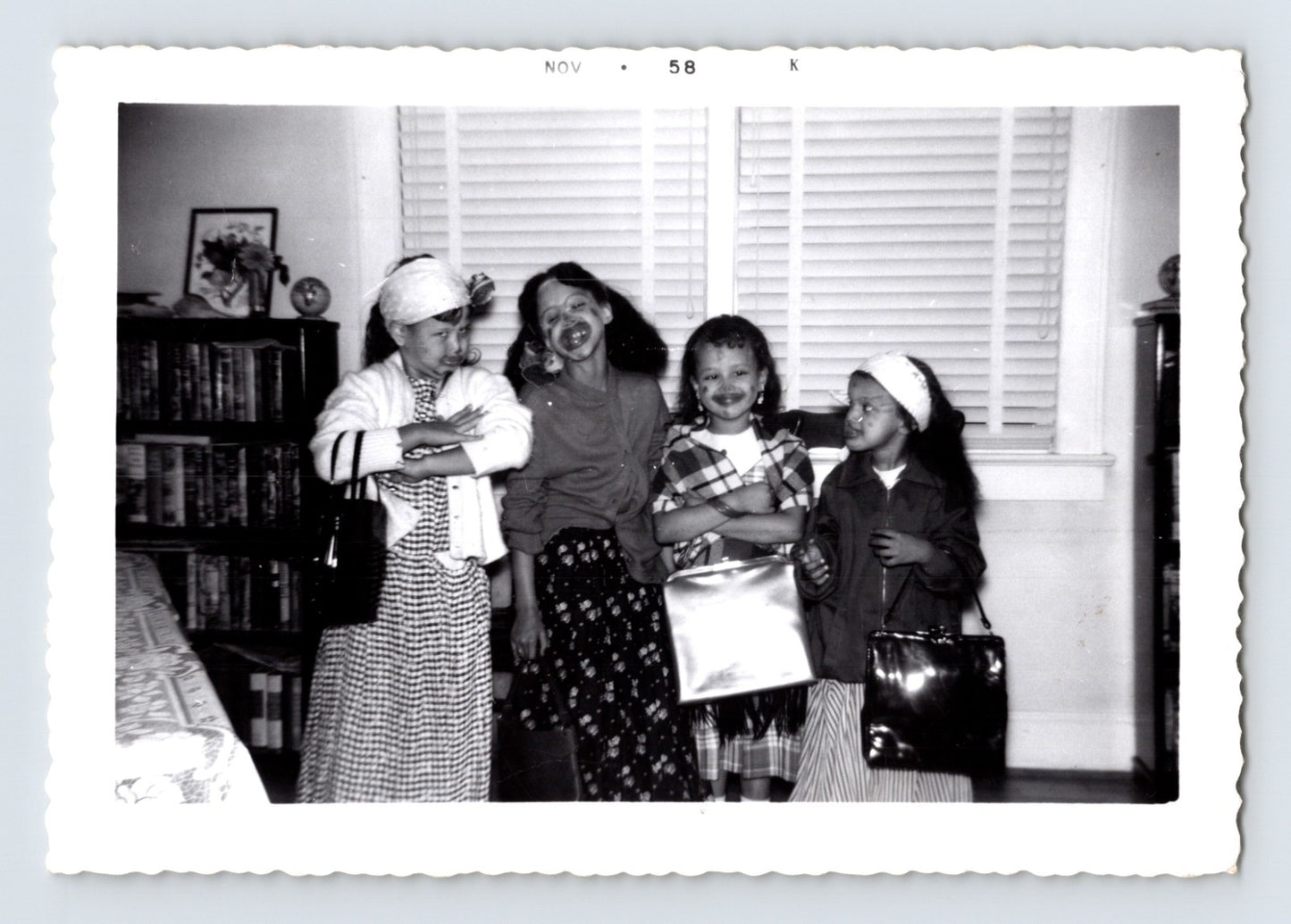Girls Halloween costume lipstick smiles handbags living room November 1958 photo