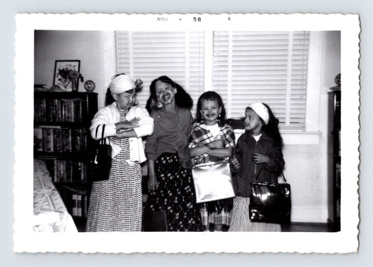 Girls Halloween costume lipstick smiles handbags living room November 1958 photo