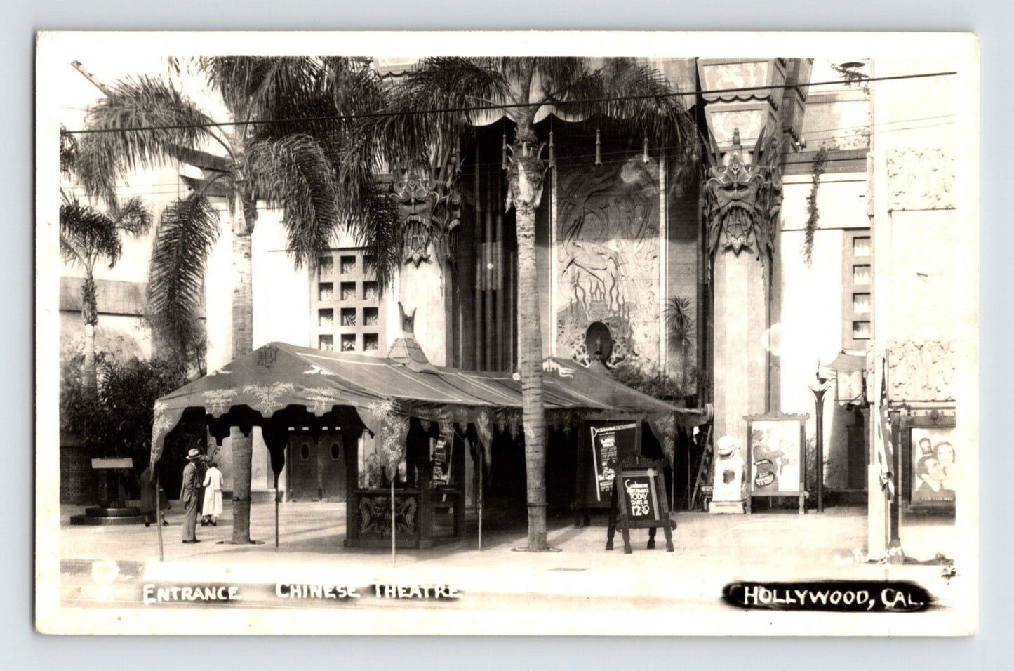 1940s real photo postcard showing the entrance to Grauman’s Chinese Theatre in Hollywood, California, with palm trees, decorative façade details, and theater marquees along Hollywood Boulevard.