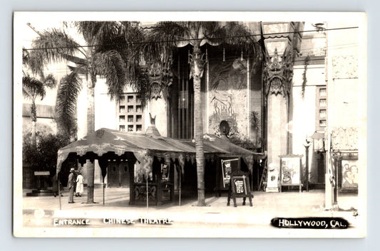 1940s real photo postcard showing the entrance to Grauman’s Chinese Theatre in Hollywood, California, with palm trees, decorative façade details, and theater marquees along Hollywood Boulevard.