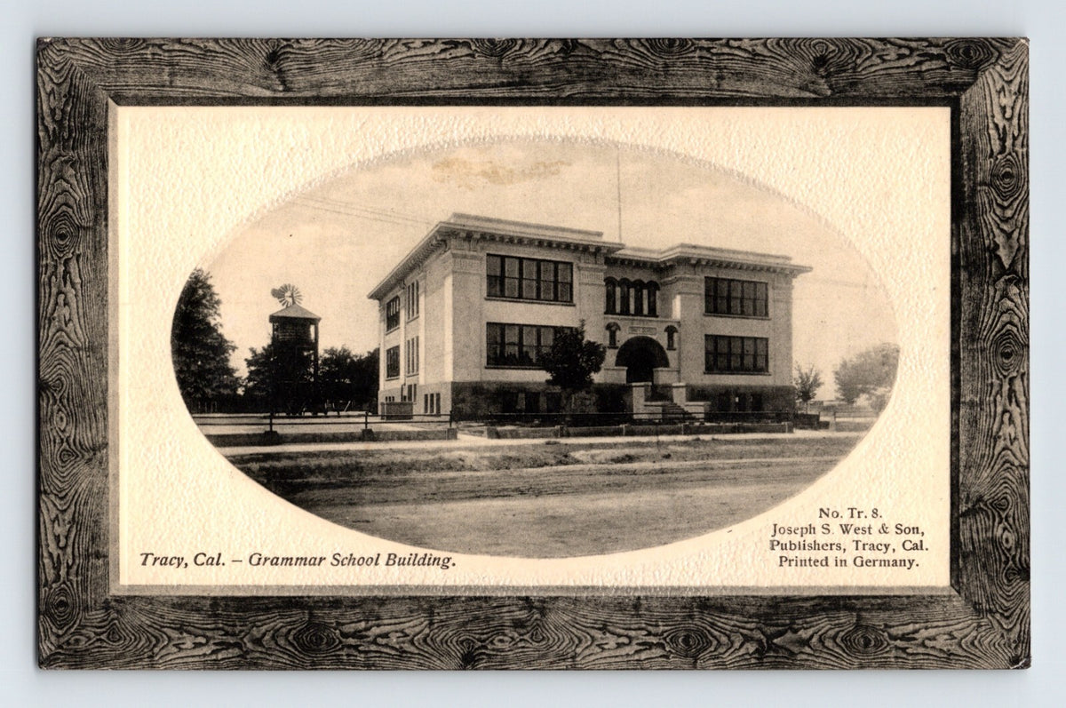 Postcard front shows oval vignette of Tracy California Grammar School building with decorative printed frame border 1910s divided back unposted