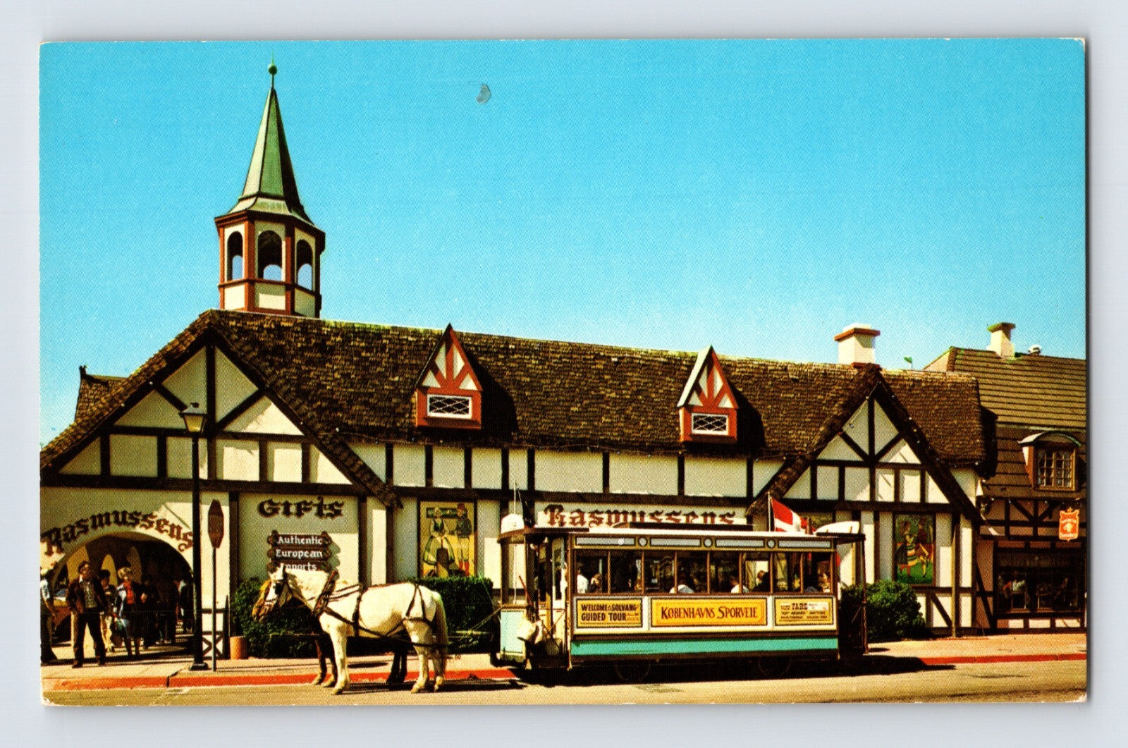 Solvang California Rasmussen Gifts shop 1960s postcard showing Danish style village buildings horse drawn carriage and storefront