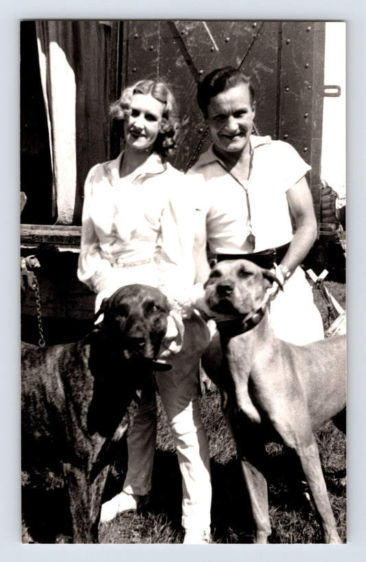Barnes Sells Floto Circus 1940s dog trainers with performing dogs beside circus wagon photograph