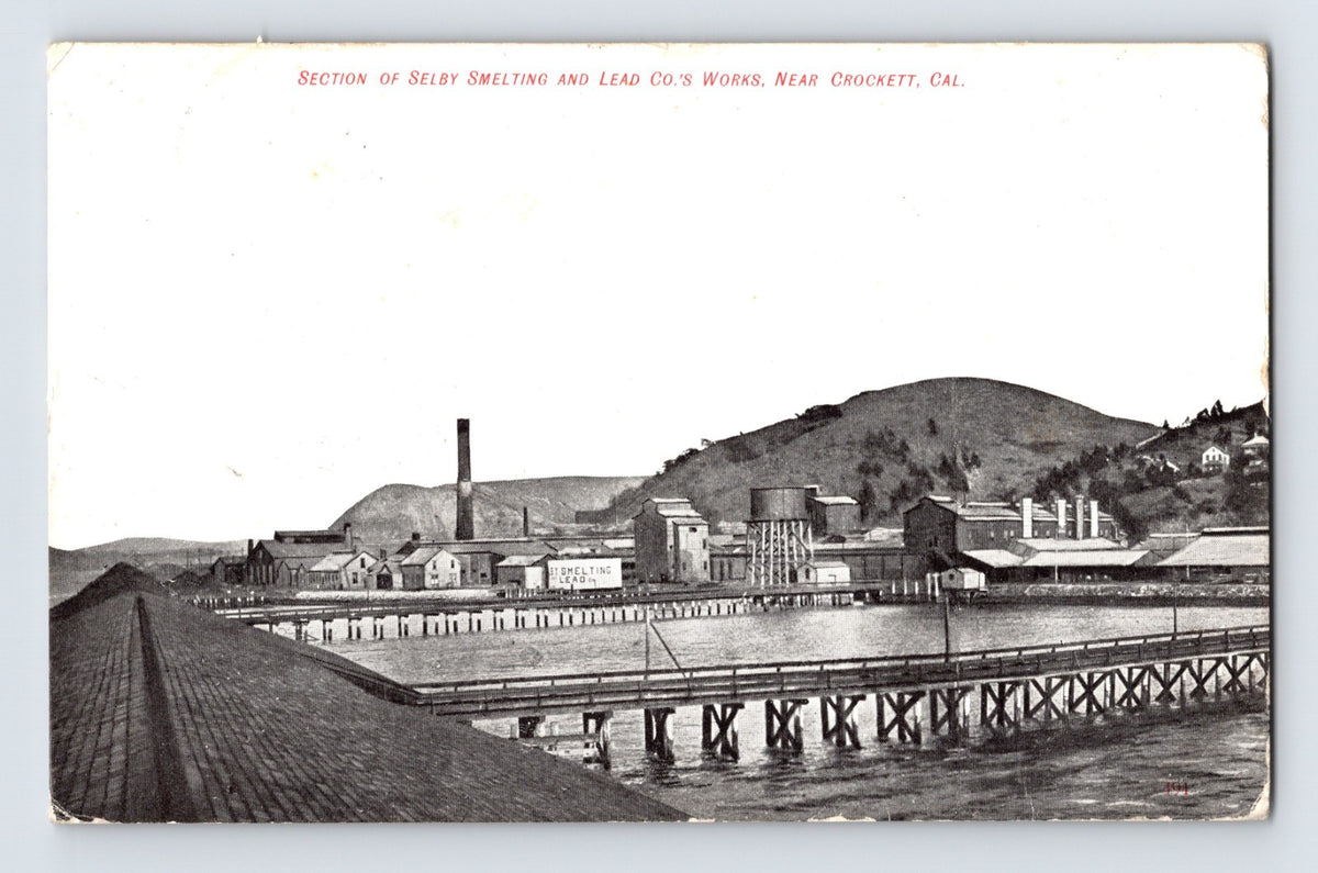 Crockett California Selby Smelting and Lead Company works postcard showing industrial waterfront buildings, smokestacks, piers, and refinery structures along the shoreline.