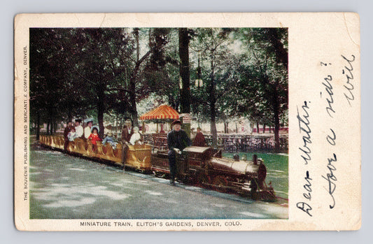 Denver Colorado Elitch Gardens miniature train 1907 postcard with passengers riding small locomotive in park setting