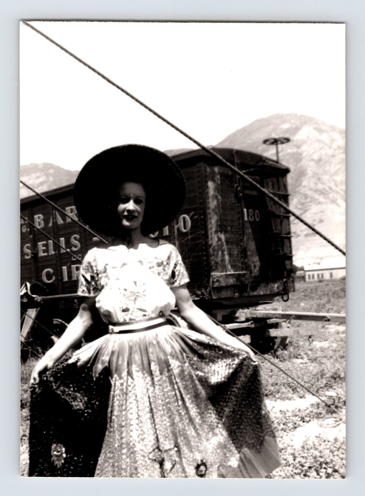 Barnes Sells Floto Circus 1940s woman performer in costume standing beside circus wagon photograph