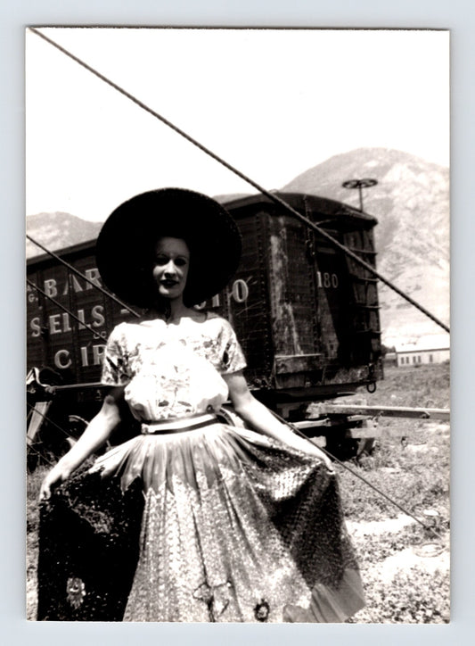 Barnes Sells Floto Circus 1940s woman performer in costume standing beside circus wagon photograph