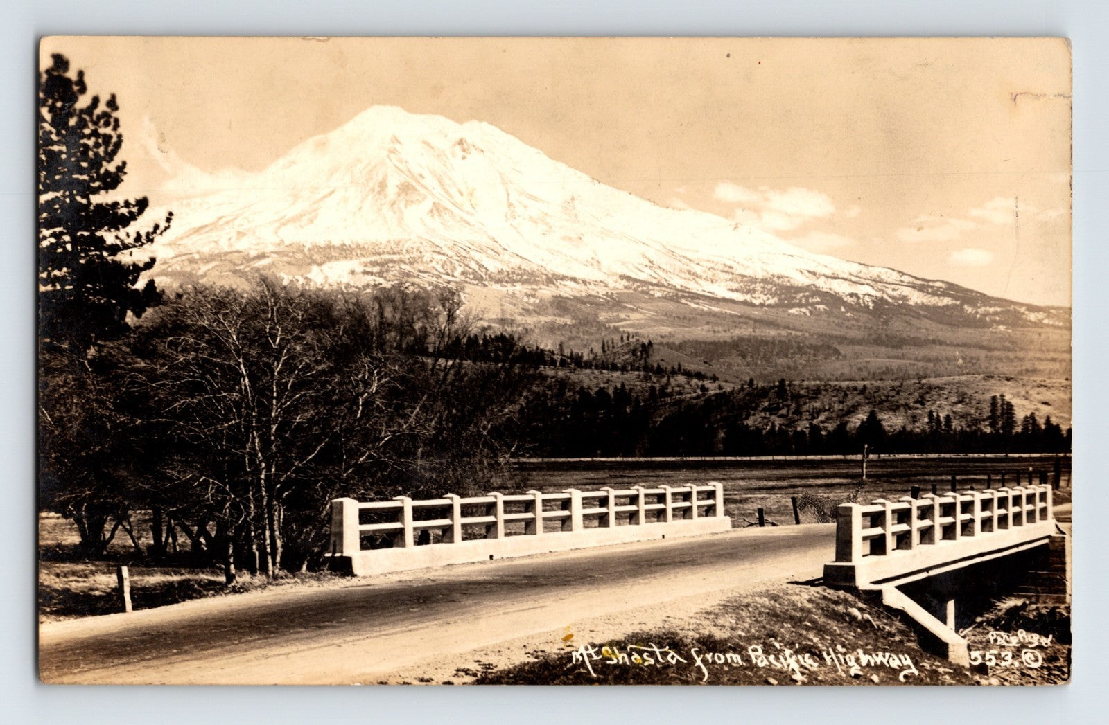 California Mount Lassen from Bunsen Highway bridge RPPC 1931 showing snow-covered peak and roadway