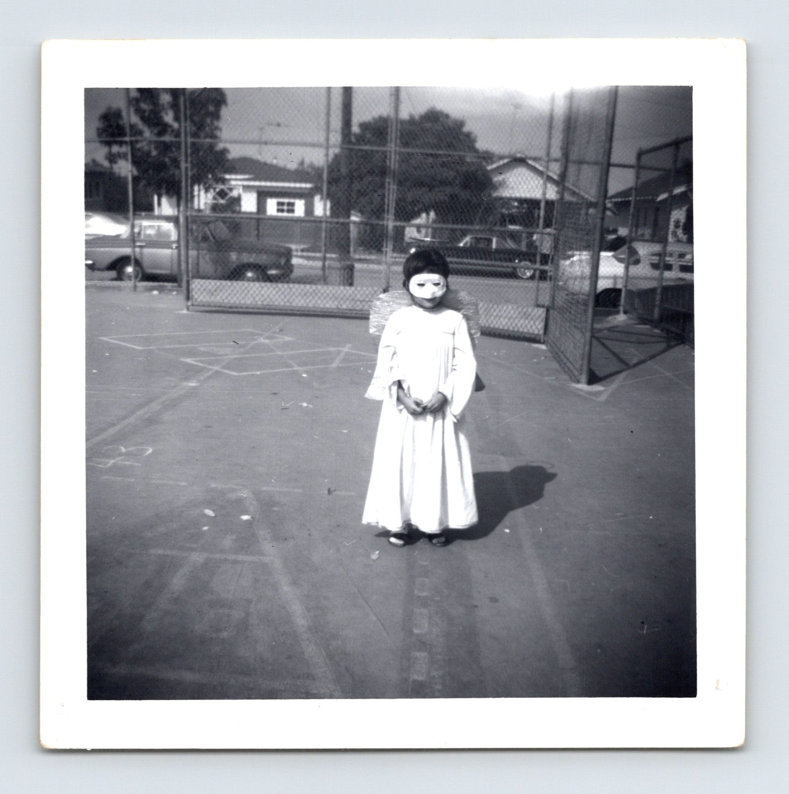 1969 Halloween child angel costume mask wings outdoor playground snapshot square photo