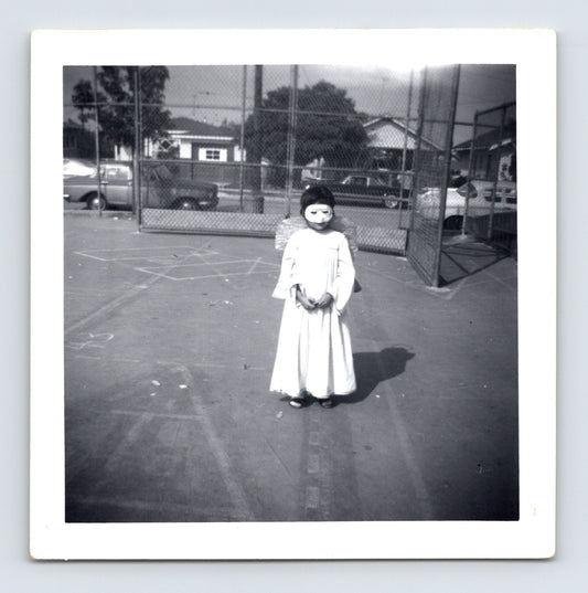 1969 Halloween child angel costume mask wings outdoor playground snapshot square photo