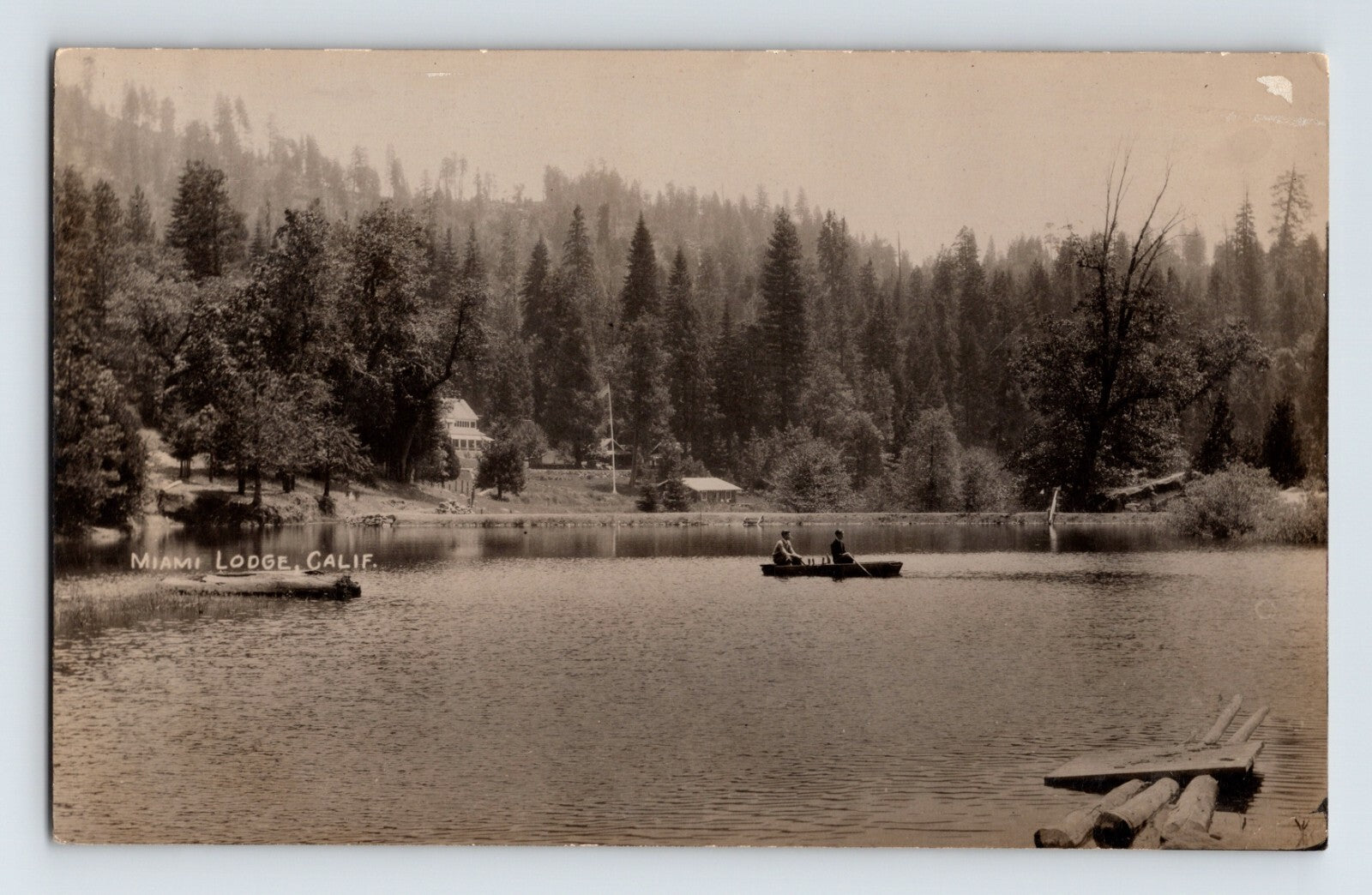 Mariposa California Miami Lodge lake scene with canoe and forested hillside 1930s real photo postcard
