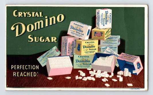 Crystal Domino Sugar Victorian trade card showing stacked cube boxes and loose sugar cubes with Perfection Reached slogan, 1890s advertising card