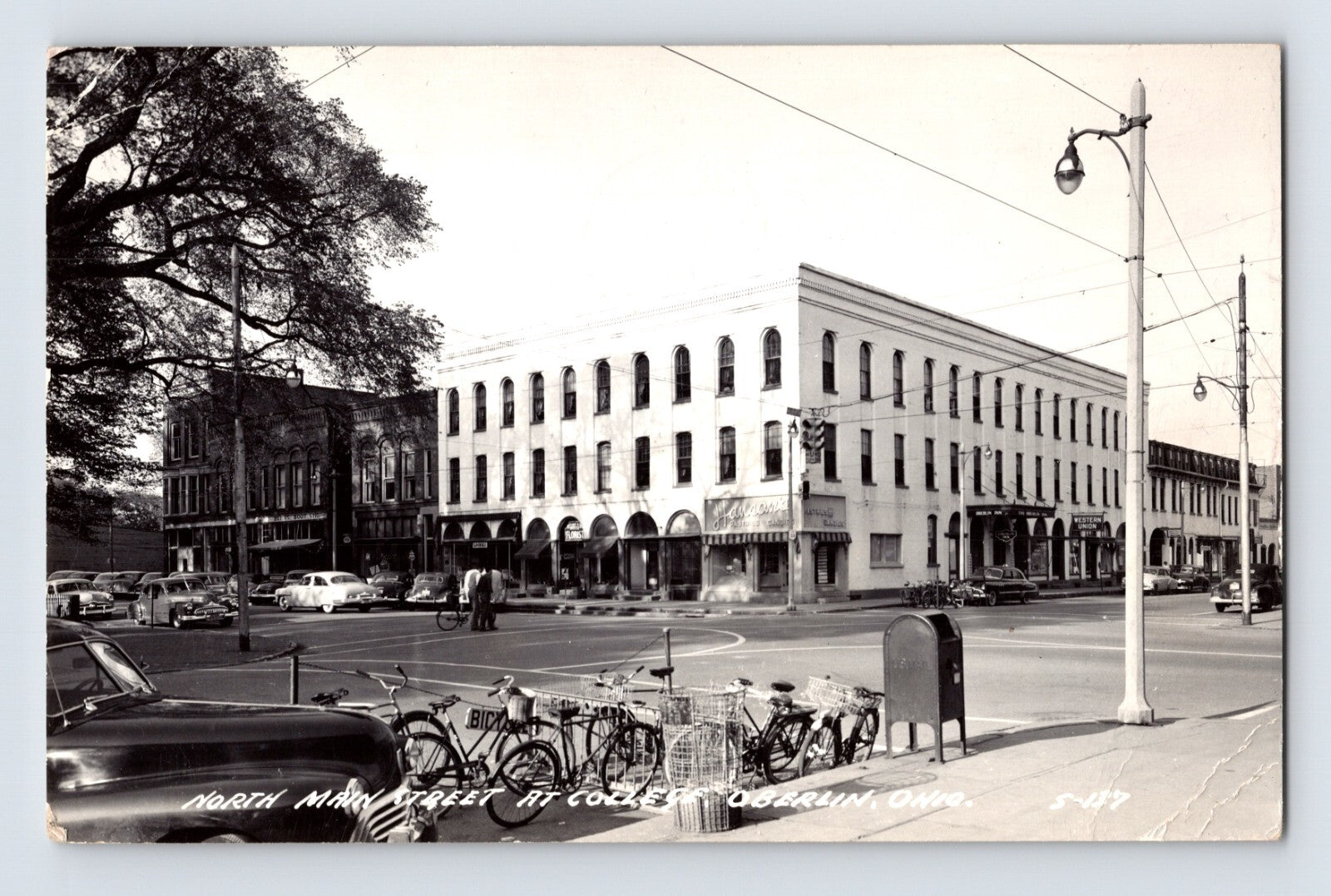 Oberlin Ohio Main Street Oberlin College district Hanson Bakery corner bicycles 1952 RPPC