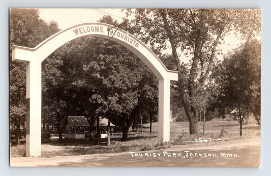 Jackson Minnesota tourist park entrance 1930s photo postcard with welcome arch trees and picnic shelter