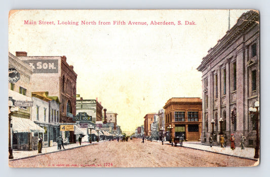 Aberdeen South Dakota Main Street looking north from Fifth Avenue Idle Hour sign 1911 postcard