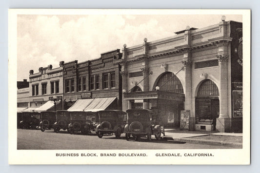 Sepia postcard view of Brand Boulevard business block with early automobiles Glendale California 1920s