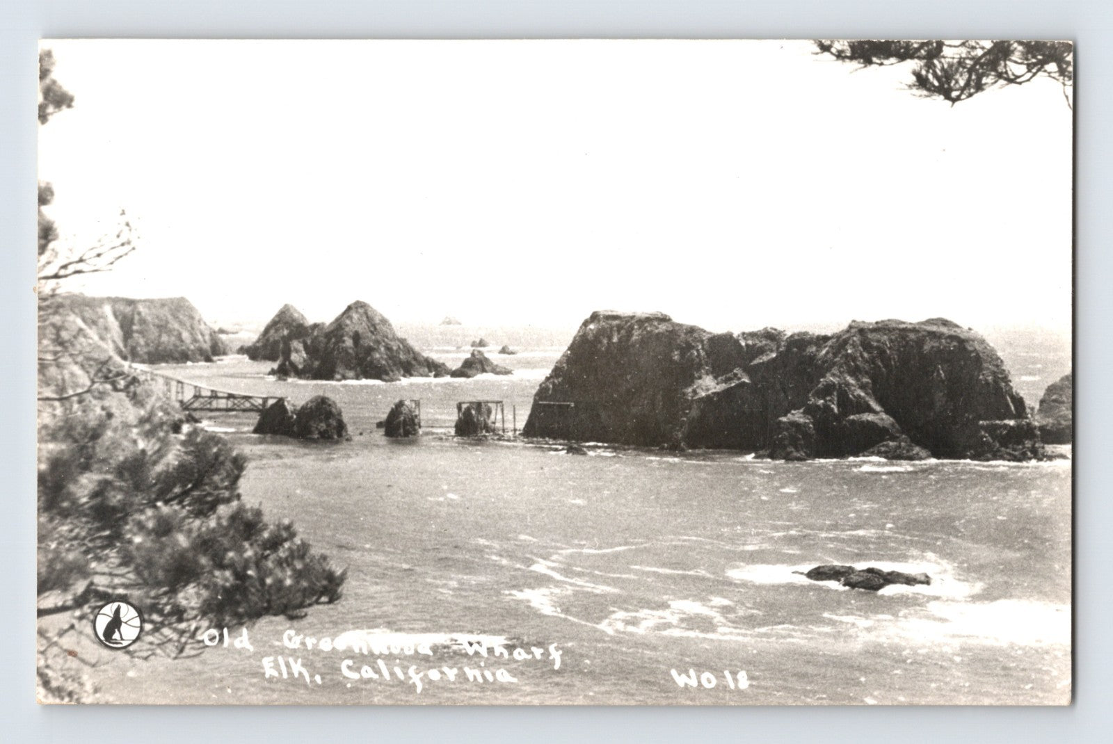 Elk California RPPC showing the remains of Greenwood Wharf with offshore rock formations along the Mendocino County coastline.