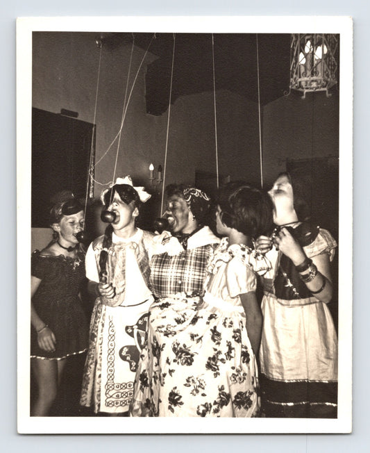 Girls Halloween bobbing for apples party dresses suspended apples game 1960s snapshot photo 5 x 4