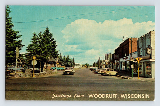 Woodruff Wisconsin Main Street downtown view 1960s cars storefronts unposted postcard