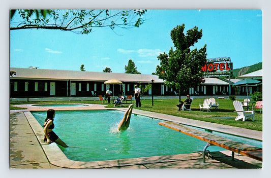 1960s postcard showing the Rip Van Winkle Motel swimming pool in New Haven, Connecticut, with guests lounging beside the pool and mid-century roadside motel architecture in the background.
