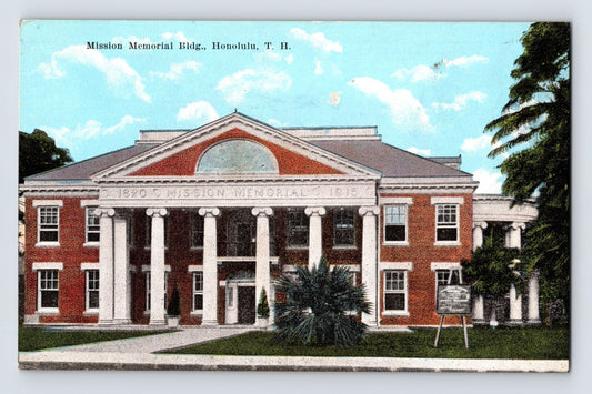 Color postcard view of the Mission Memorial Building in Honolulu, Hawaii, showing the red-brick neoclassical structure with white columns and tropical landscaping.