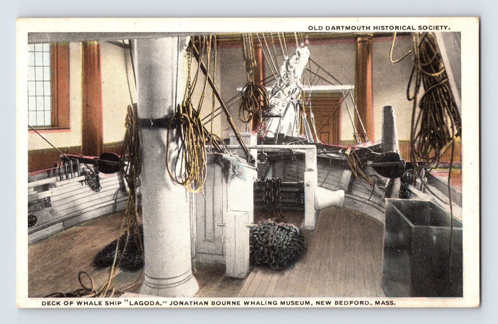Interior deck view of whale ship Lagoda with rigging, ropes, capstan and coiled chains at Jonathan Bourne Whaling Museum New Bedford Massachusetts