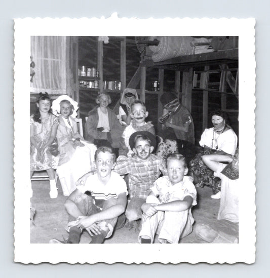 Halloween 1950s children costumes group party masks face paint indoor snapshot vintage photo