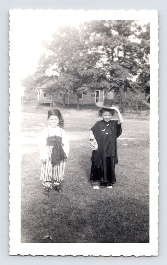 Halloween children witch costume striped outfit yard rural house 1940s snapshot