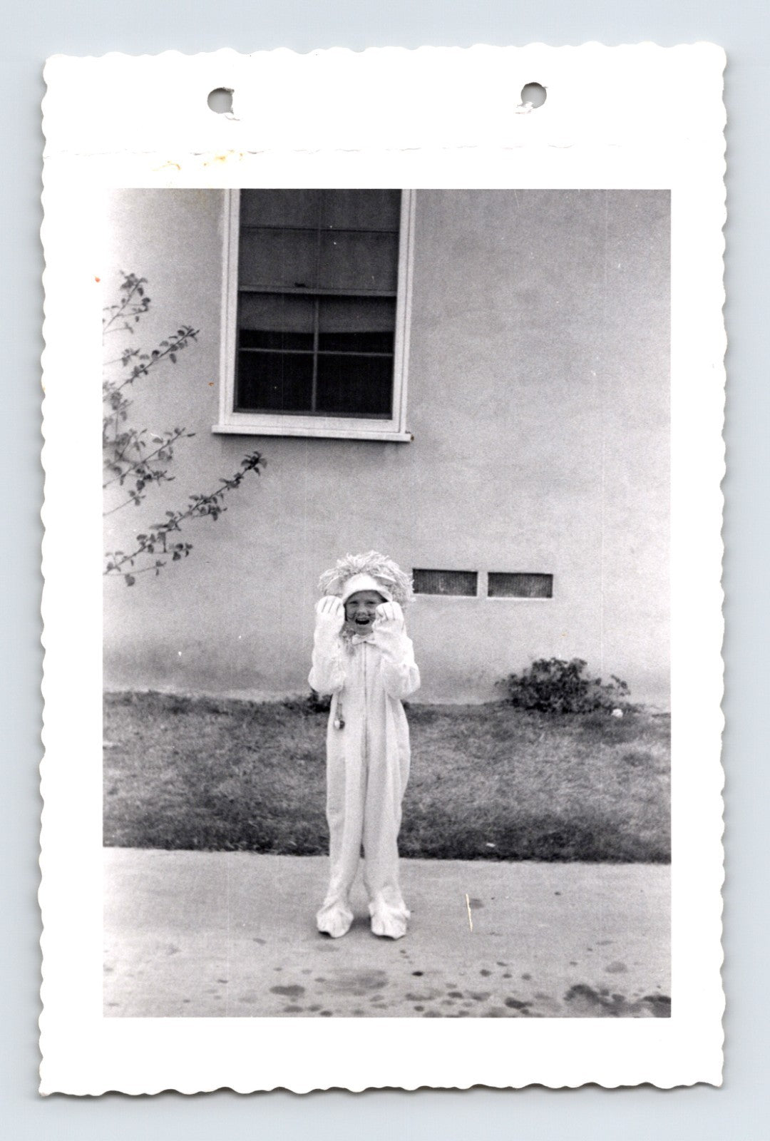 Halloween photo child costume lion suit outdoor sidewalk 1960s snapshot kid in animal costume yard scene 5 x 3.25