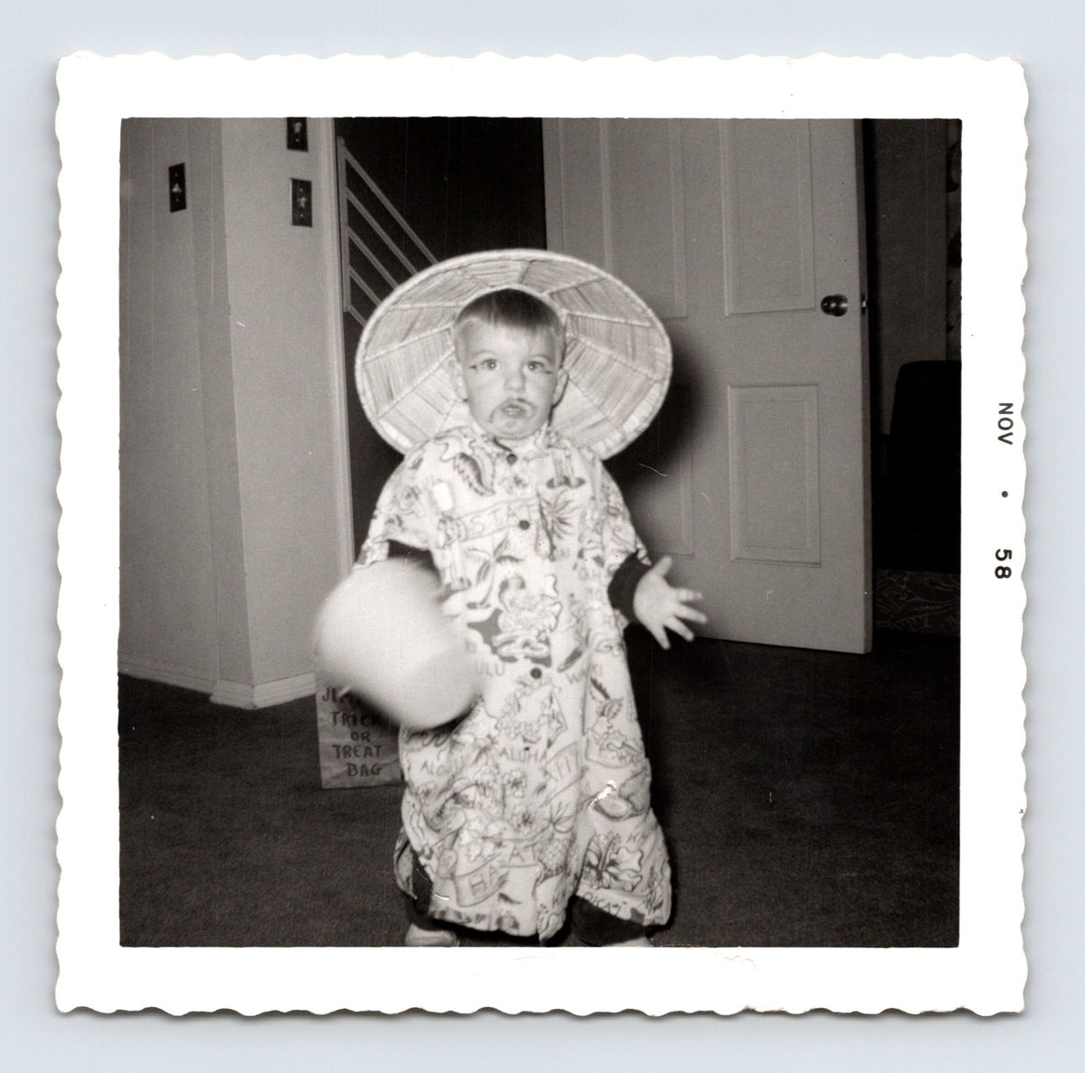1958 Halloween child costume conical hat trick or treat bag indoor snapshot square photo