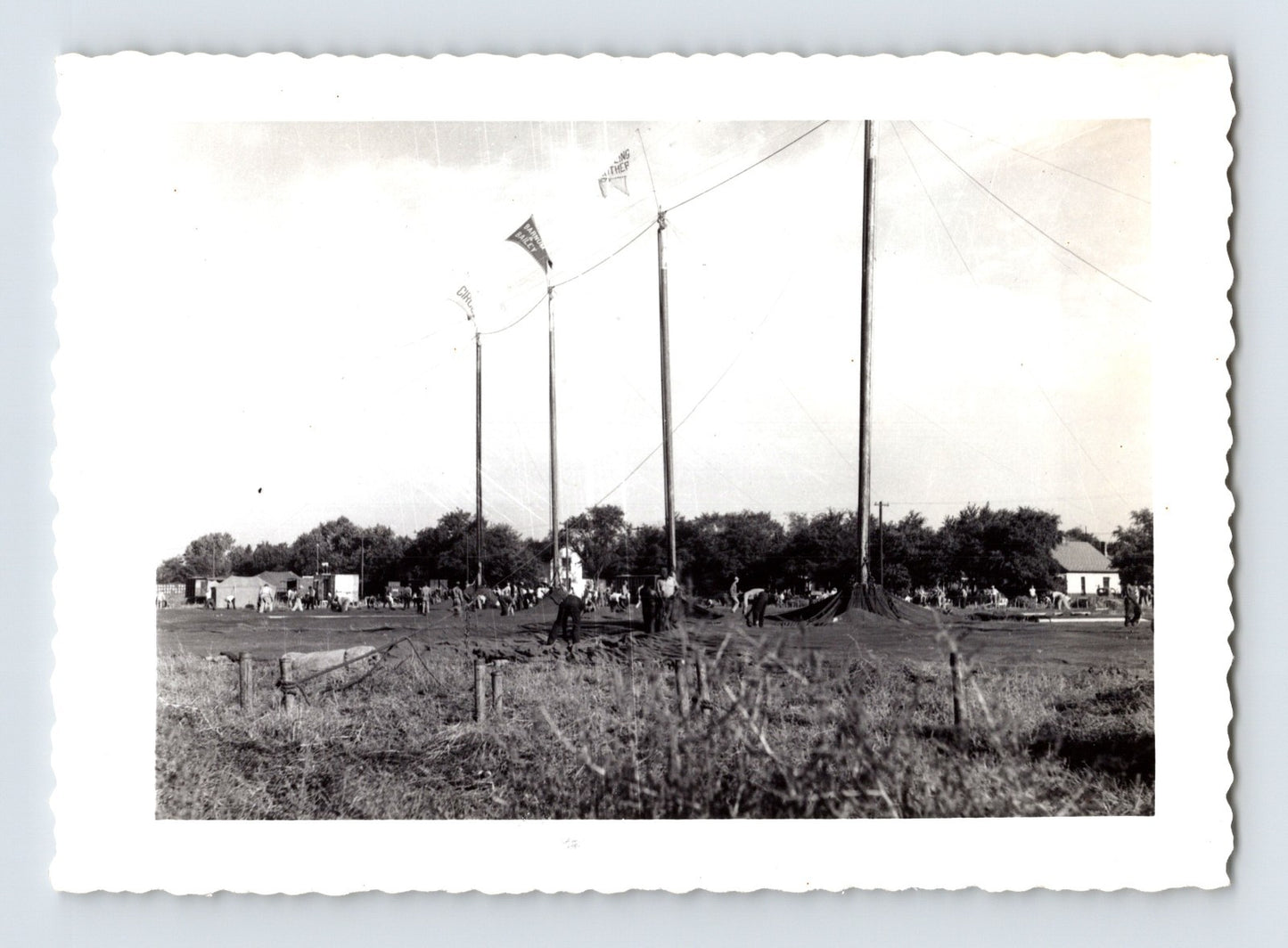 Ringling Bros Barnum Bailey circus workers raising big top tent poles