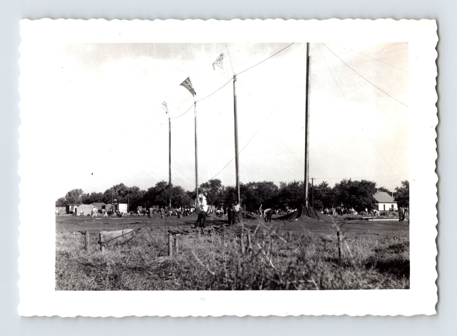 Ringling Bros Barnum Bailey circus workers raising big top tent poles