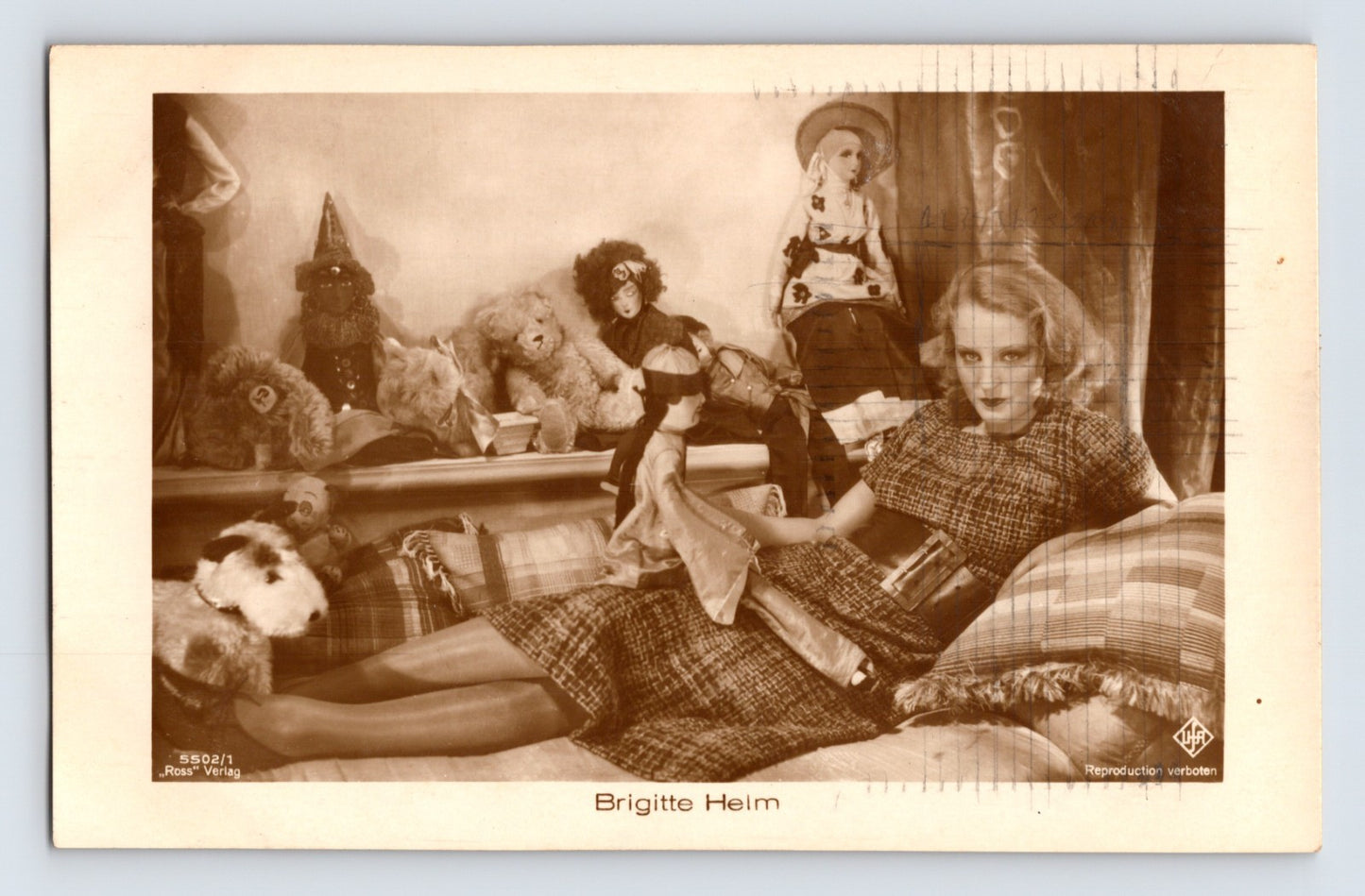 Brigitte Helm 1930s RPPC postcard silent film actress posed with dolls UFA studio portrait