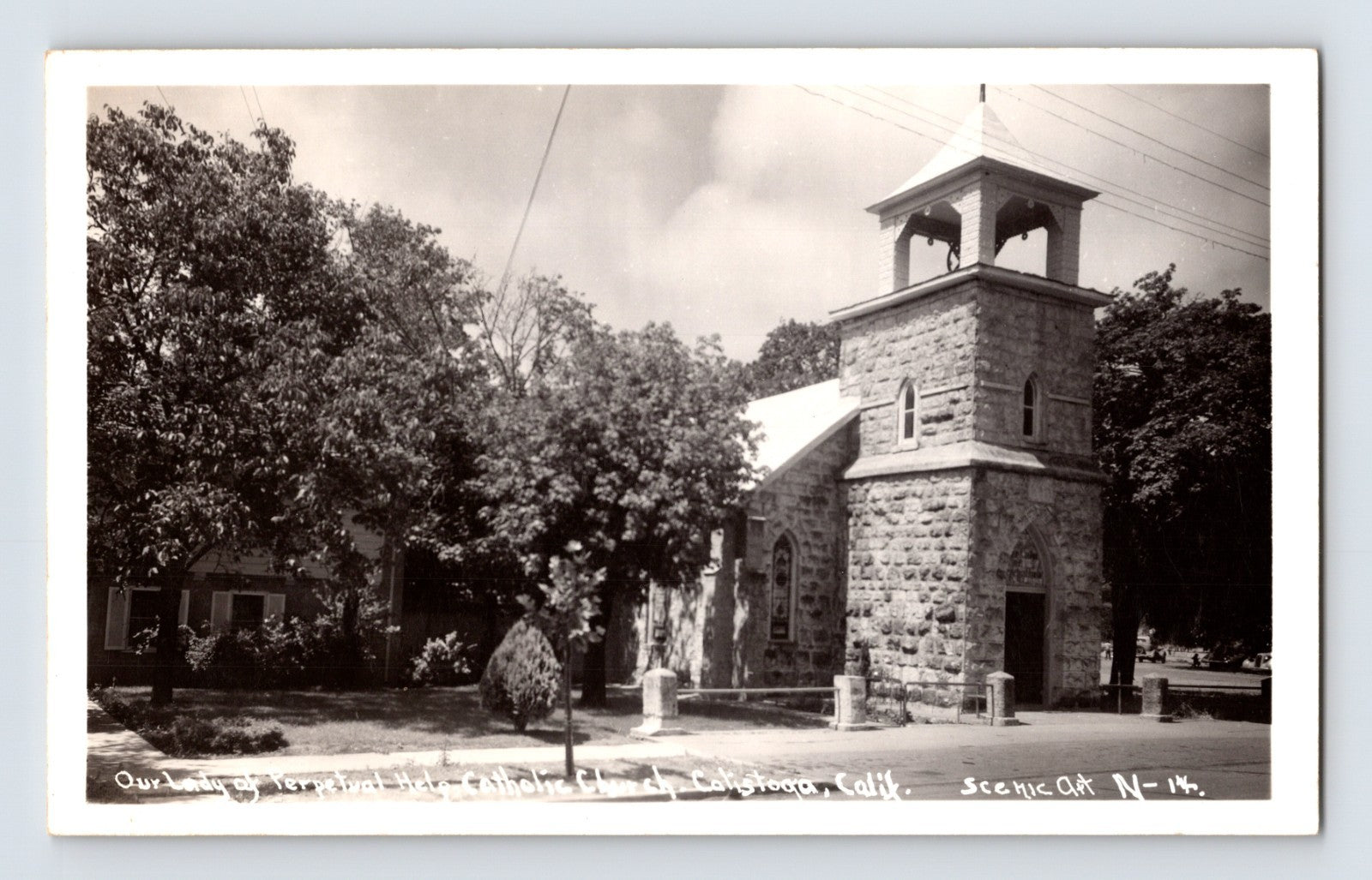 Calistoga California Our Lady of Perpetual Help Catholic Church real photo postcard with stone bell tower dated 1951.