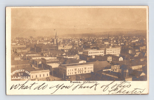 Real photo postcard of downtown Eureka California aerial view with 1906 copyright by J A Meiser and handwritten 1907 message