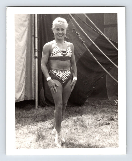 Mills Bros Circus showgirl performer posing beside big top tent ropes 1964 candid photograph