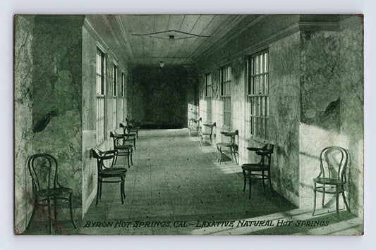 Long hallway with chairs on either side, Byron Hot Springs, California, on a white background